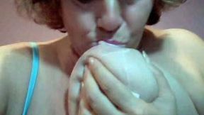 Filthy Granny whore is sucking her saggy breasts on webcam