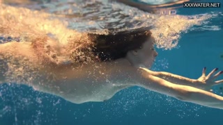 Perfect body blonde teen enjoys naked swimming