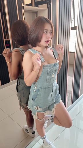 Female model in denim overalls