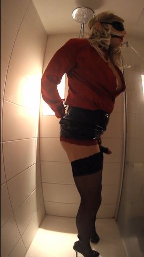 Transvestite tied with vibrating buttplug and penis sleeve