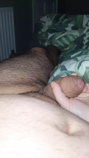 Step son laid down in bed get a handjob from step mom