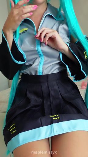 Professional blonde solo model poses in Hatsune Miku cosplay