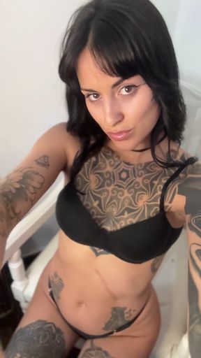Tattooed woman in lingerie