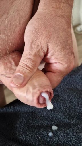 Jerking my thick uncut cock to get my creamy cum out...