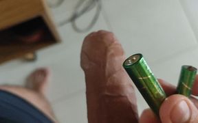 Inserting Electric Batteries Inside the Wet Dick
