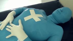 Patient In Blue Latex Catsuit With Condom Mask Bondaged And Fucked Hard