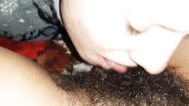 She licks her girlfriends hairy pussy until she begs for mercy cum