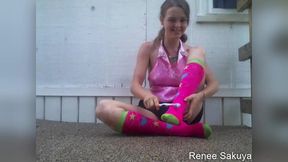 tickling with a tooth brush outside in knee socks