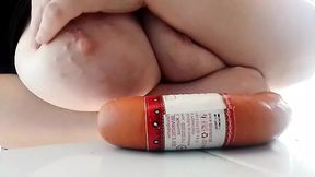 A sausage between the tits