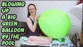 Blowing Up A Big Green Balloon by the Pool