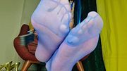 A fetish for feet in blue sheer stockings. Feast your eyes on the soles of this sexy beauty.