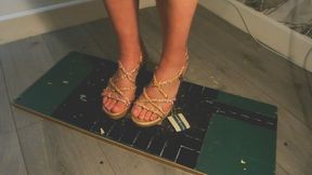 Giantess goddess WinnieLouxo Crushes a Ford Mustang GT350 in gold wedges with painted toenails close right view plus box of broken cars stomping