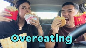 Eating a huge burger in the car