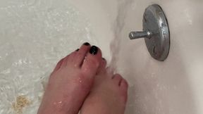 Washing my feet in the bathtub