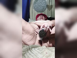 Screwing a Brush in Her Bushy Bush