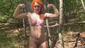 Sexy Redhead Strong Woman Showing Her Big Muscles in the Forest, Face Included in the Video