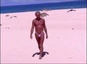 Tanned guy on beach in tiny string thong (temporarily!)