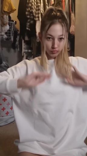 Blonde girl in white sweatshirt
