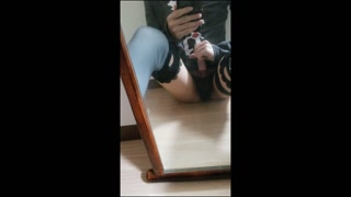 A femboy masturbating in front of the mirror