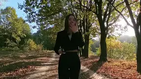 Brunette Teases Outdoors Among Autumn Trees