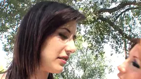 Sapphic lovers share intimate kiss and caress