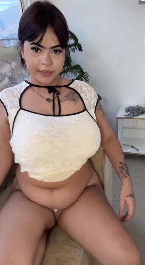 Curvy solo lady sits and plays with herself