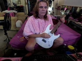 Liz Young playing guitar