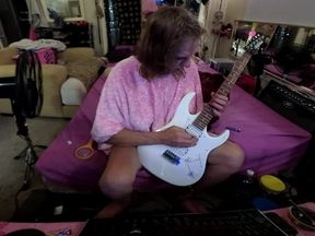 Liz Young playing guitar