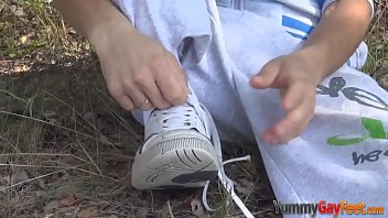 Teen licking his toes