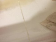 Russian guy pissing in the bath closeup