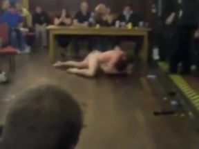 College men wrestle naked in classroom