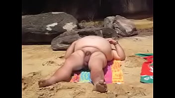 big nude guy at the beach