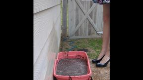 Fifi loses her shiny black patent heels in a container of sticky deep mud