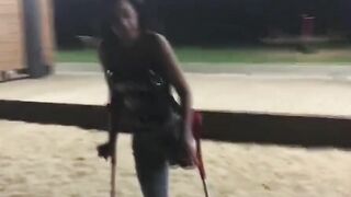 amputee woman crutching into beach