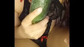 Mary Janne sticks a cucumber in her young pussy