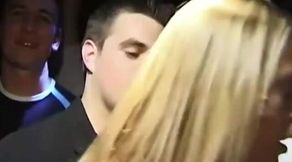Stockinged beauty flashes bare below in crowded club