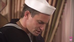 Sailor fucks curly blonde in doggy on the couch