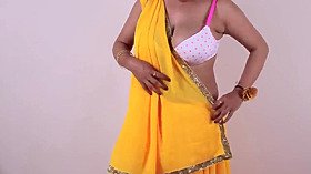 Hot ladies dressed in sari & displaying her large boobs cleavage