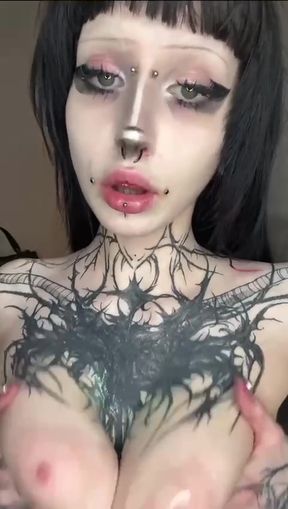 Tattooed woman with piercings