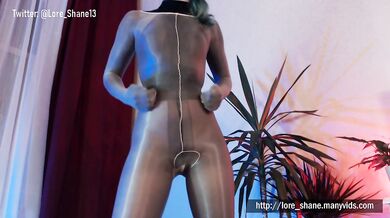 Black & tan nylon encasement layers her feet while she teases herself raw
