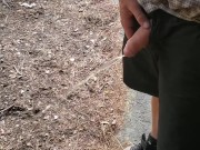 Boy peeing outside cabin
