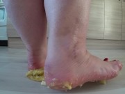 a big mature woman, bbw, smash a banana with bare feet, heels. crash trampl