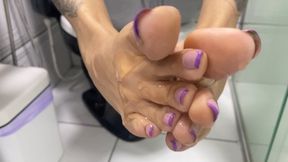spreading lubricant on feet
