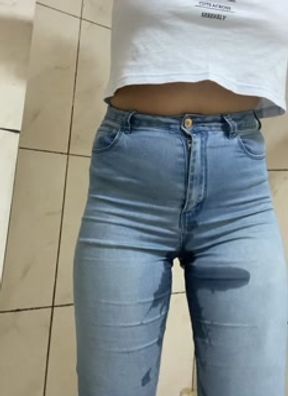 Desperate to pee, peeing in my jeans, wetting my jeans with my warm pee.