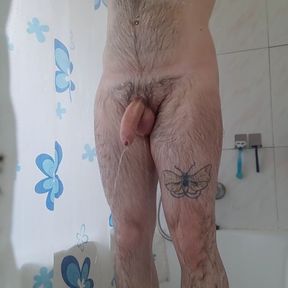 Hairy man takes a shower and masturbates