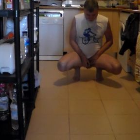 John is peeing on the kitchen floor