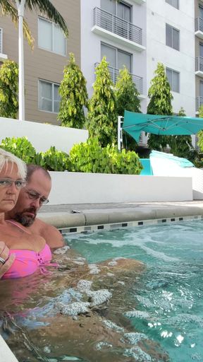Getting frisky in the hot tub. Boob play.
