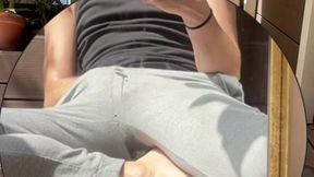 amateur boy wets his grey sweatpants