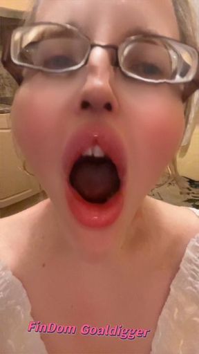 Girl in huge eyeglasses is yawning in the kitchen