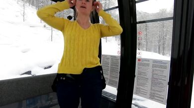 Petite exhibitionist skiing nude in public on a cable car caught on camera